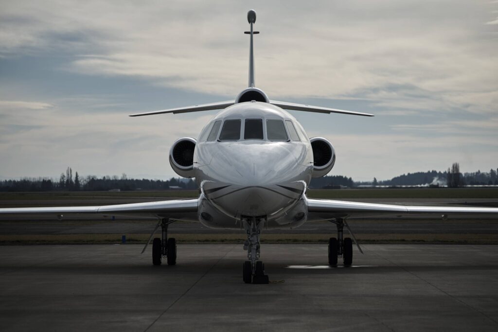 front of airplane on landing strip